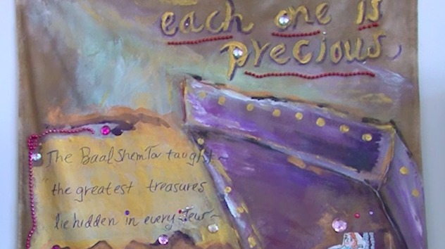A painted purple treasure chest with gold dots and jewels, lettered: each one is precious. The Baal Shem Tov taught: the greatest treasures lie hidden in every Jew.